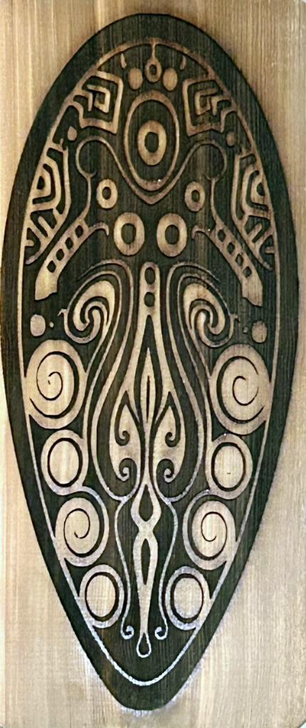 Wood Burn design of an abstract squid on cedar